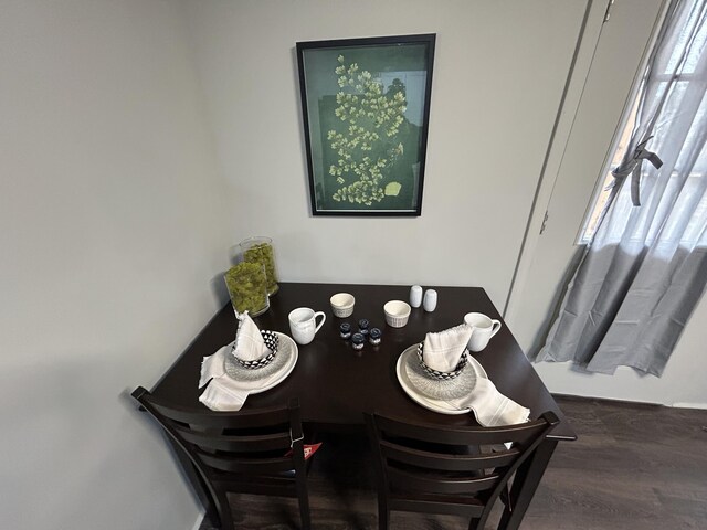 dining room with dark wood-type flooring