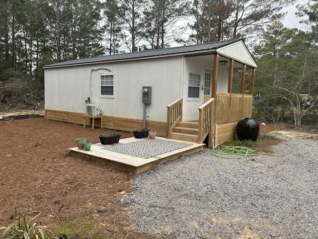 back of property featuring ac unit