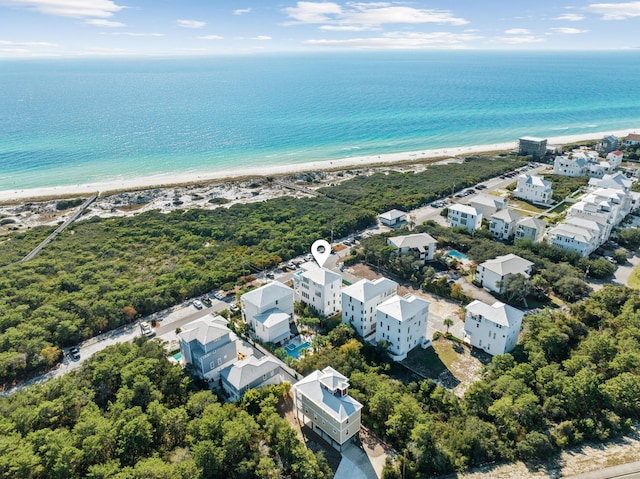 birds eye view of property featuring a water view and a view of the beach