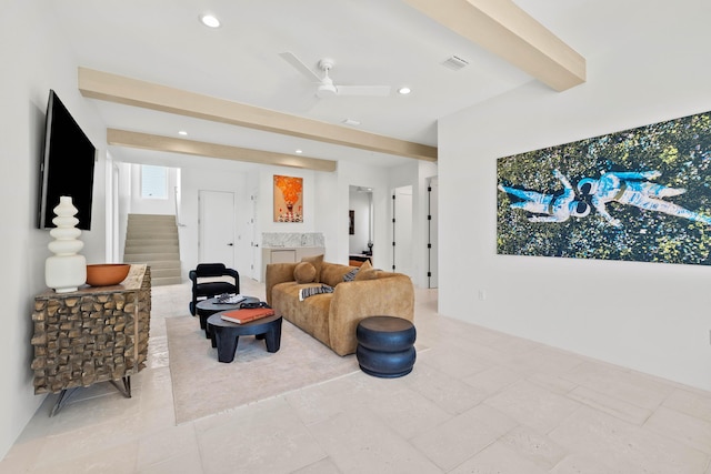 living area featuring recessed lighting, visible vents, a ceiling fan, stairs, and beamed ceiling