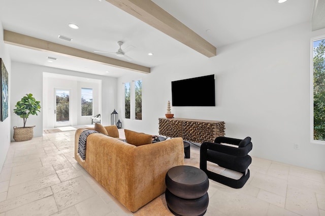 living room featuring beamed ceiling, recessed lighting, visible vents, and stone tile floors