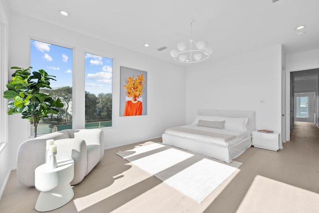 bedroom with a chandelier, wood finished floors, visible vents, and recessed lighting