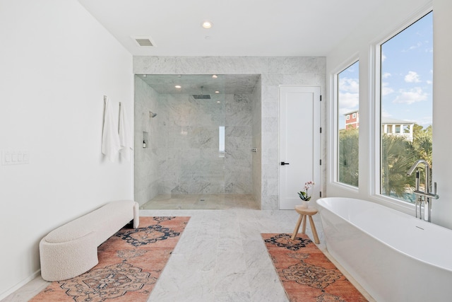 full bathroom featuring a freestanding bath, a marble finish shower, visible vents, and recessed lighting