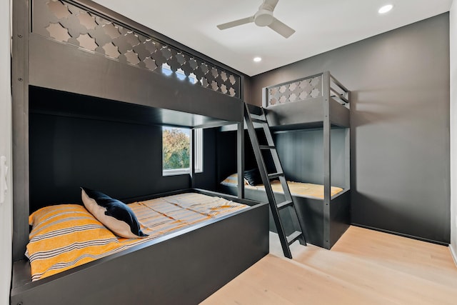 bedroom featuring ceiling fan, wood finished floors, and recessed lighting