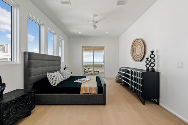 bedroom with recessed lighting, wood finished floors, visible vents, baseboards, and access to outside