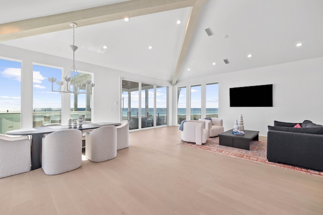 living room with beamed ceiling, wood finished floors, visible vents, and recessed lighting