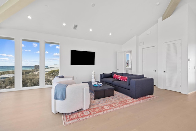 living room featuring recessed lighting, visible vents, and wood finished floors