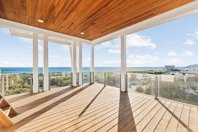 wooden terrace with a water view