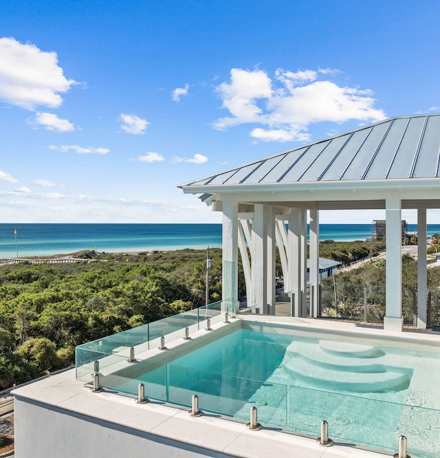 outdoor pool featuring a water view