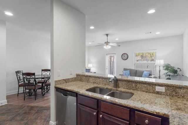 8872 White Ibis Way, Navarre, FL 32566 - kitchen with a sink, light stone counters, stainless steel dishwasher, and recessed lighting