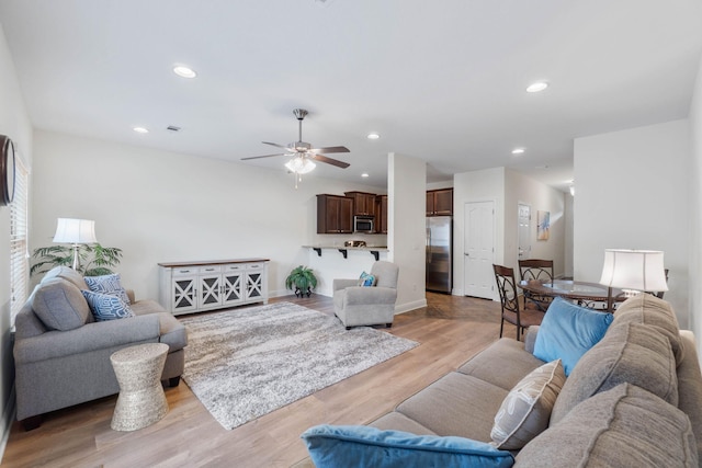 8872 White Ibis Way, Navarre, FL 32566 - living area featuring ceiling fan, visible vents, baseboards, recessed lighting, and light wood-style flooring