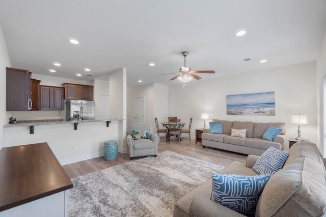 8872 White Ibis Way, Navarre, FL 32566 - living area featuring recessed lighting, ceiling fan, baseboards, and light wood-style floors