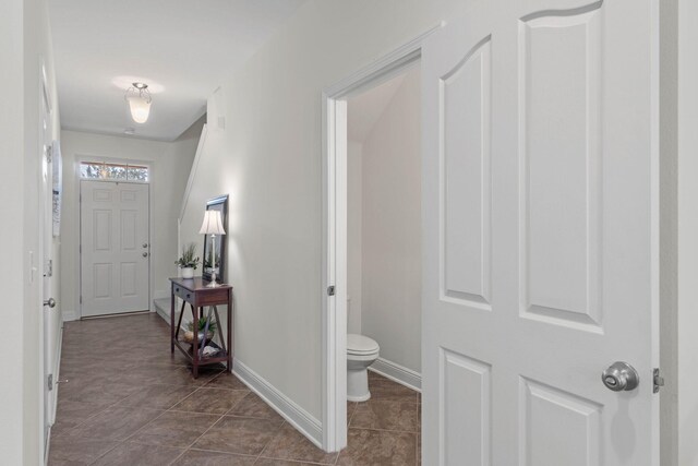 8872 White Ibis Way, Navarre, FL 32566 - hall with baseboards and dark tile patterned floors