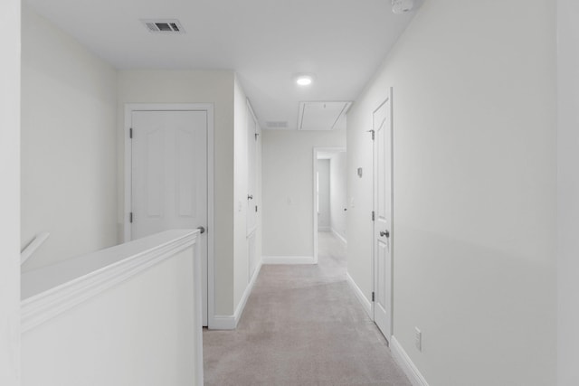 8872 White Ibis Way, Navarre, FL 32566 - hall featuring light colored carpet, baseboards, visible vents, and attic access