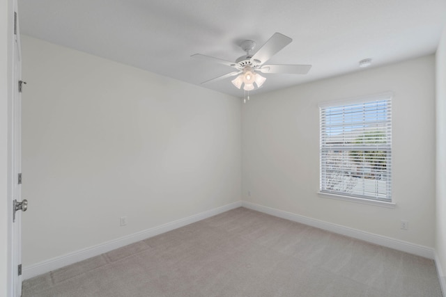 8872 White Ibis Way, Navarre, FL 32566 - unfurnished room featuring light colored carpet, a ceiling fan, and baseboards