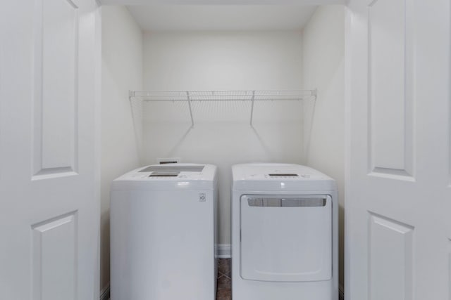 8872 White Ibis Way, Navarre, FL 32566 - laundry room featuring separate washer and dryer and laundry area