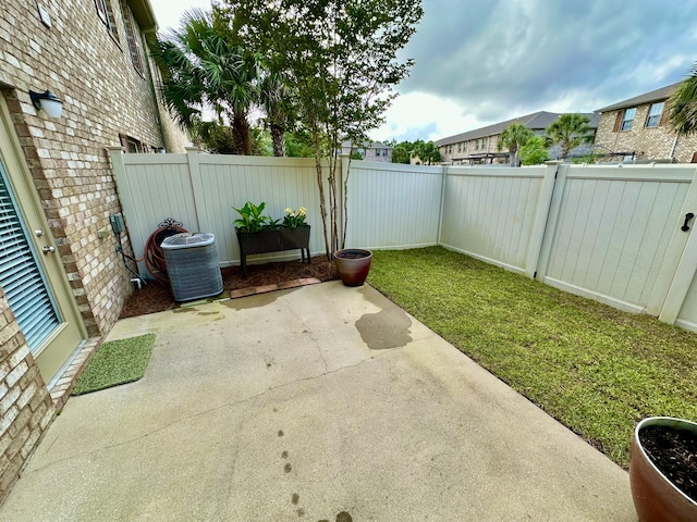 8872 White Ibis Way, Navarre, FL 32566 - view of yard featuring a fenced backyard, a patio area, and cooling unit