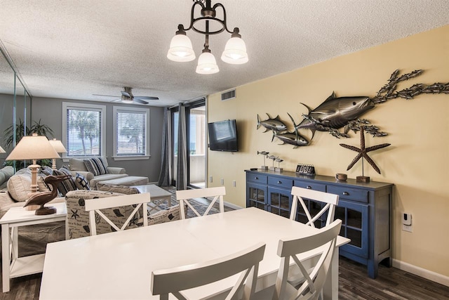 500 Gulf Shore Dr Unit 115B, Destin, FL 32541 - dining area with dark hardwood / wood-style flooring, ceiling fan, and a textured ceiling