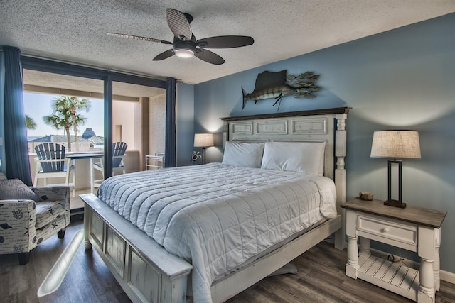 500 Gulf Shore Dr Unit 115B, Destin, FL 32541 - bedroom with dark hardwood / wood-style flooring, ceiling fan, and a textured ceiling