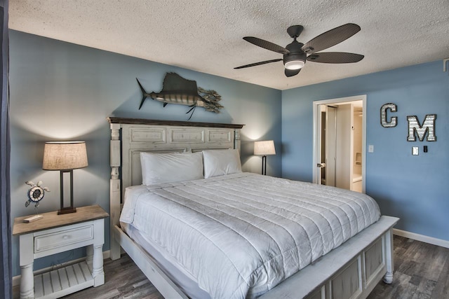 500 Gulf Shore Dr Unit 115B, Destin, FL 32541 - bedroom with dark wood-type flooring, a textured ceiling, and ensuite bathroom