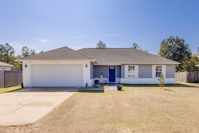 ranch-style house with a garage and a front yard