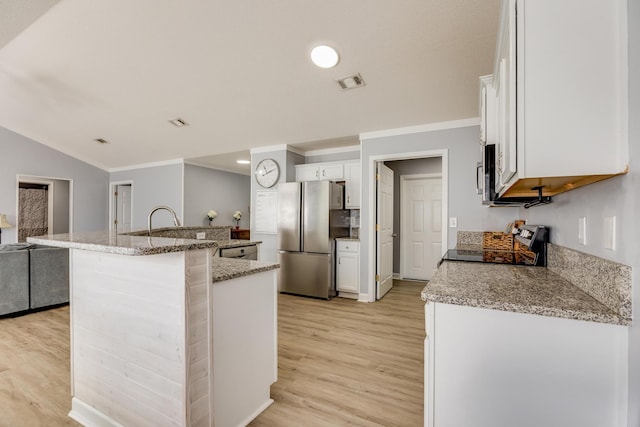 kitchen with light hardwood / wood-style flooring, a kitchen island with sink, stainless steel appliances, light stone counters, and white cabinets