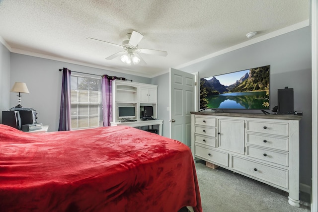 carpeted bedroom featuring ceiling fan, ornamental molding, and a textured ceiling