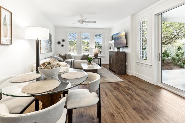 dining area featuring dark hardwood / wood-style floors and ceiling fan