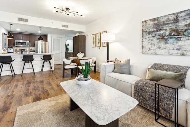 living room with dark hardwood / wood-style floors