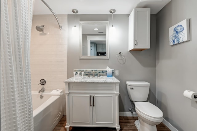 full bathroom featuring shower / tub combo with curtain, wood-type flooring, toilet, and vanity