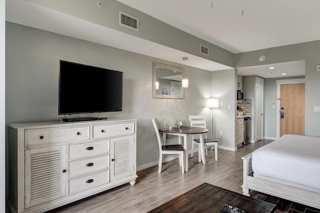 bedroom featuring hardwood / wood-style floors