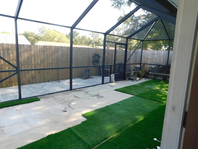 view of yard with a lanai and a patio area