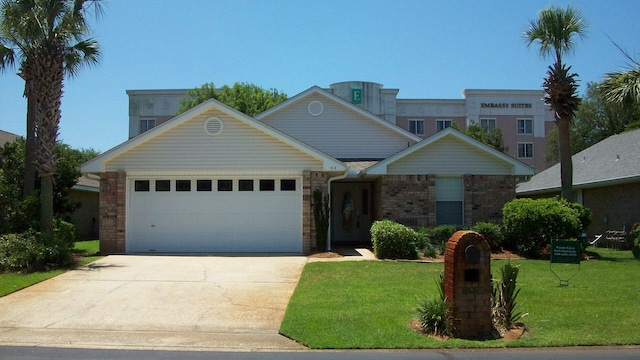 view of front of home with a garage and a front yard