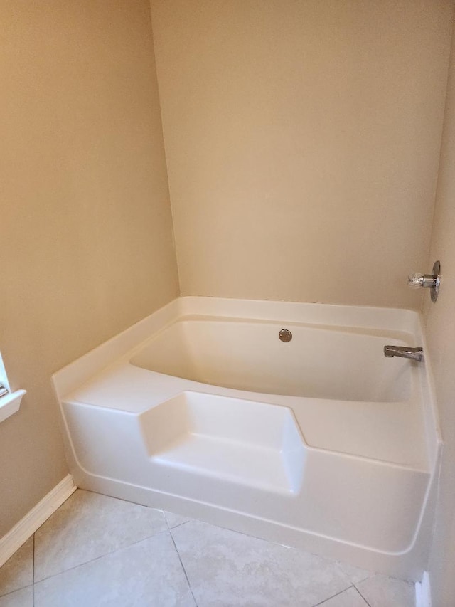 bathroom featuring tile patterned floors and a bathtub