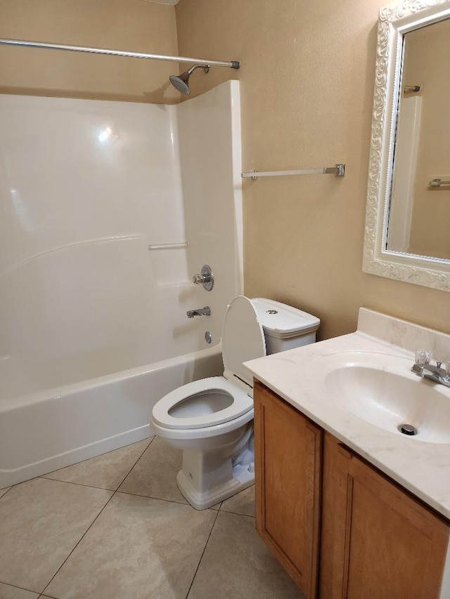 full bathroom with vanity, bathtub / shower combination, tile patterned floors, and toilet