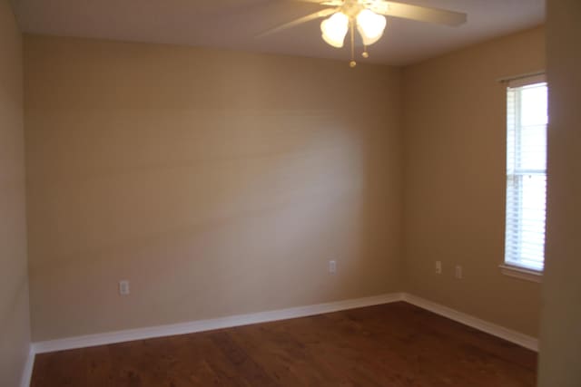 spare room featuring ceiling fan and wood-type flooring