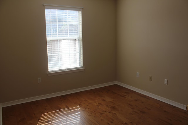 spare room with wood-type flooring