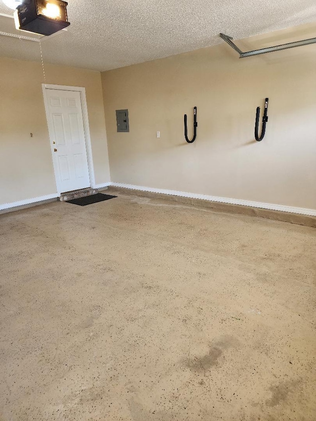 garage featuring a garage door opener and electric panel