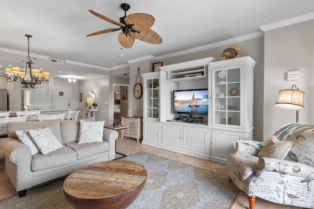 living room featuring ornamental molding, ceiling fan with notable chandelier, and light tile patterned floors