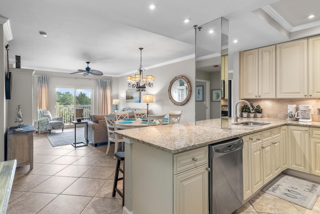 kitchen featuring sink, dishwasher, a kitchen breakfast bar, ornamental molding, and light stone countertops