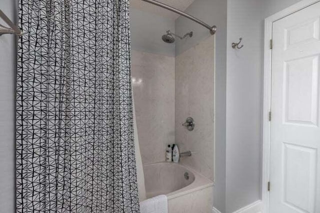 bathroom featuring shower / tub combo with curtain