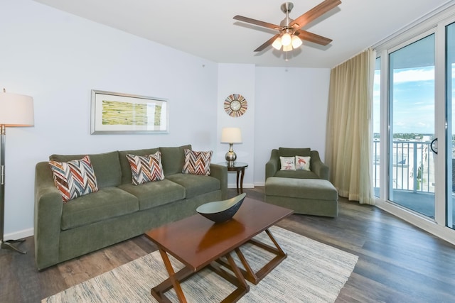 living room with ceiling fan and hardwood / wood-style floors