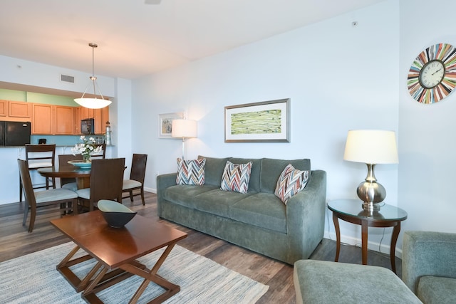 living room with dark wood-type flooring