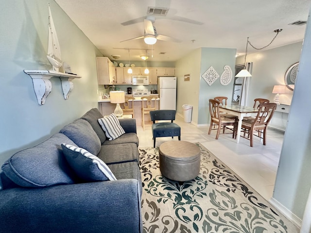 living room with ceiling fan