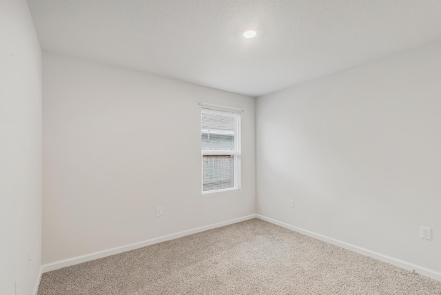 unfurnished room with carpet floors