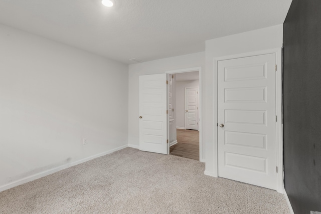 unfurnished bedroom with carpet flooring