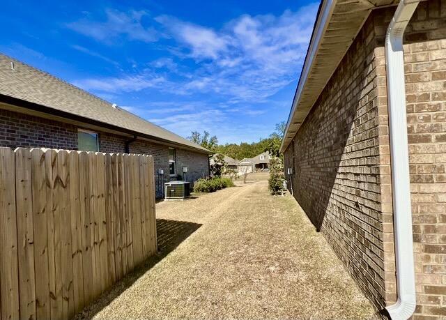 view of yard with central AC unit