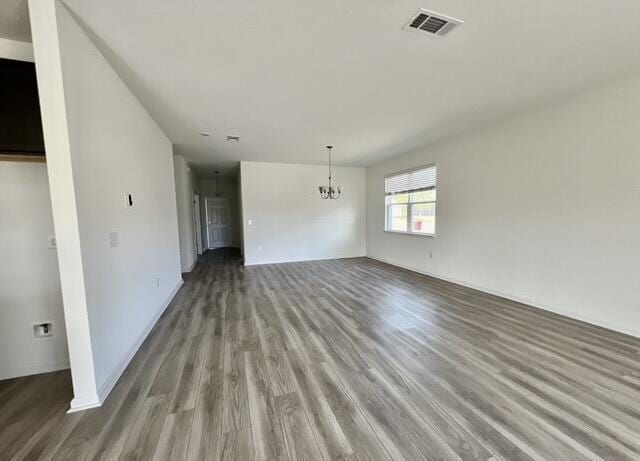 interior space featuring an inviting chandelier and hardwood / wood-style floors