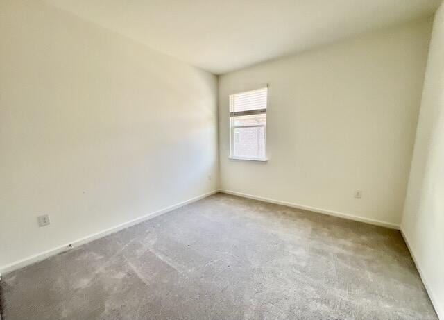 unfurnished room with carpet flooring