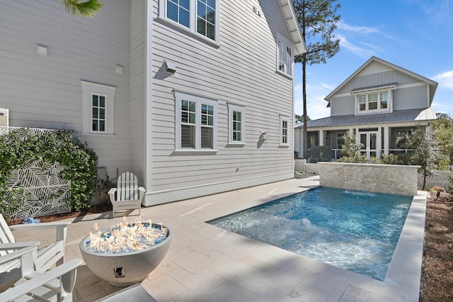 view of pool featuring a patio and pool water feature